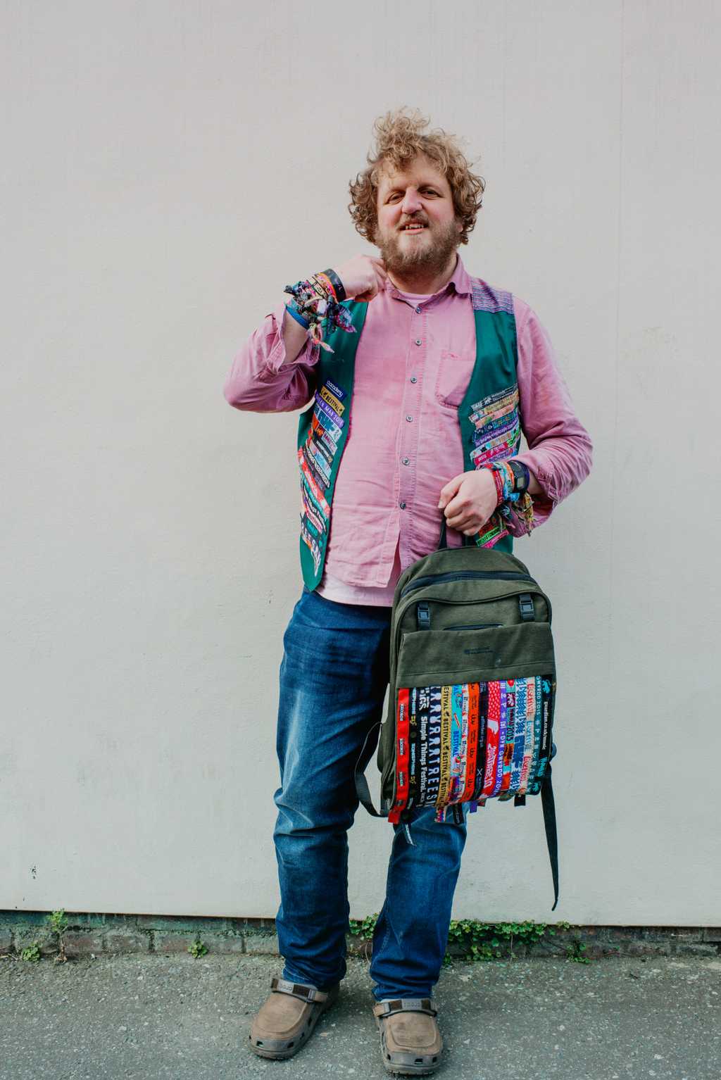 A portrait photo of big Jeff in a pink shirt and excellent woven waistcoat